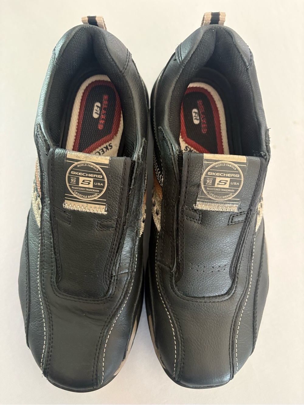 Skechers Black Slip-On Loafers with Tan Pull Tabs